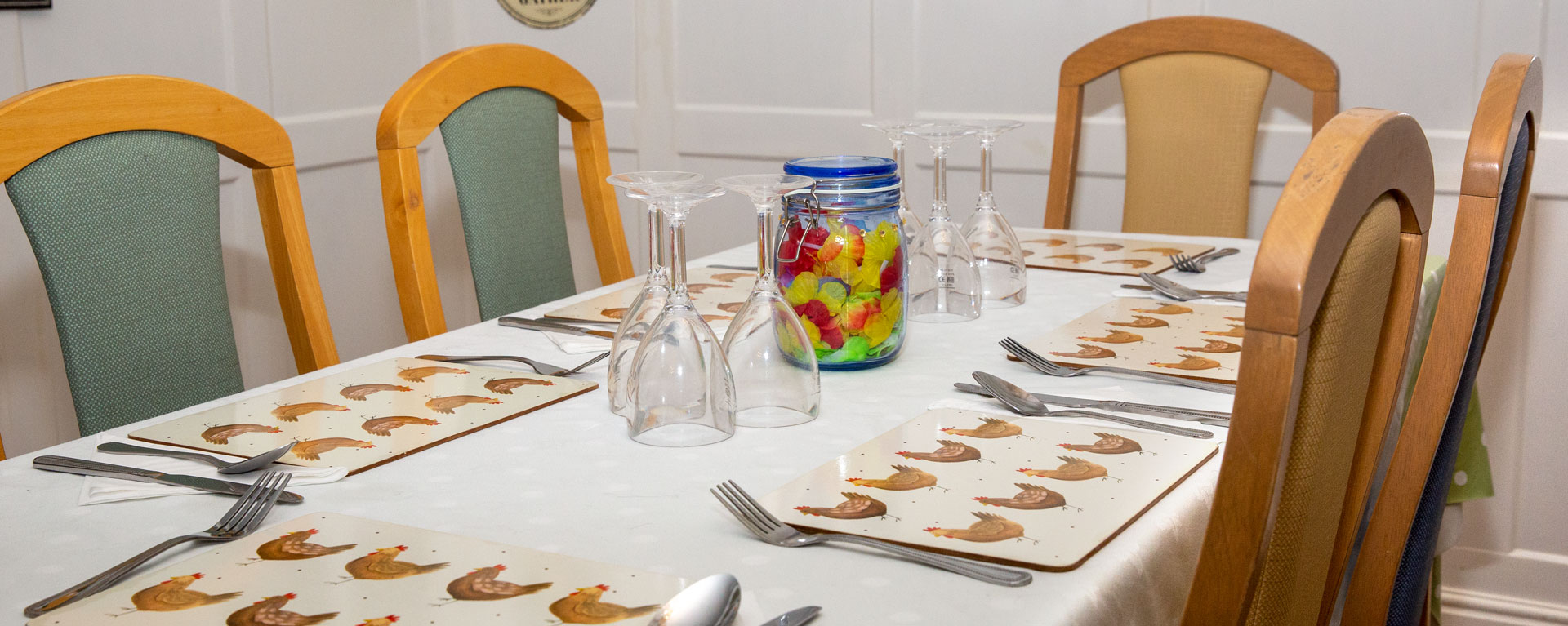 A laid dinner table in the dinning room