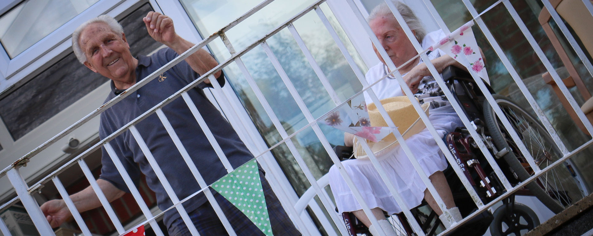 Residents on the balcony cheering