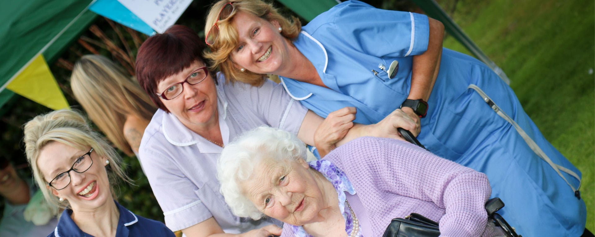 Group of residents and nurses posing for a picture at Laurel Care Home fete