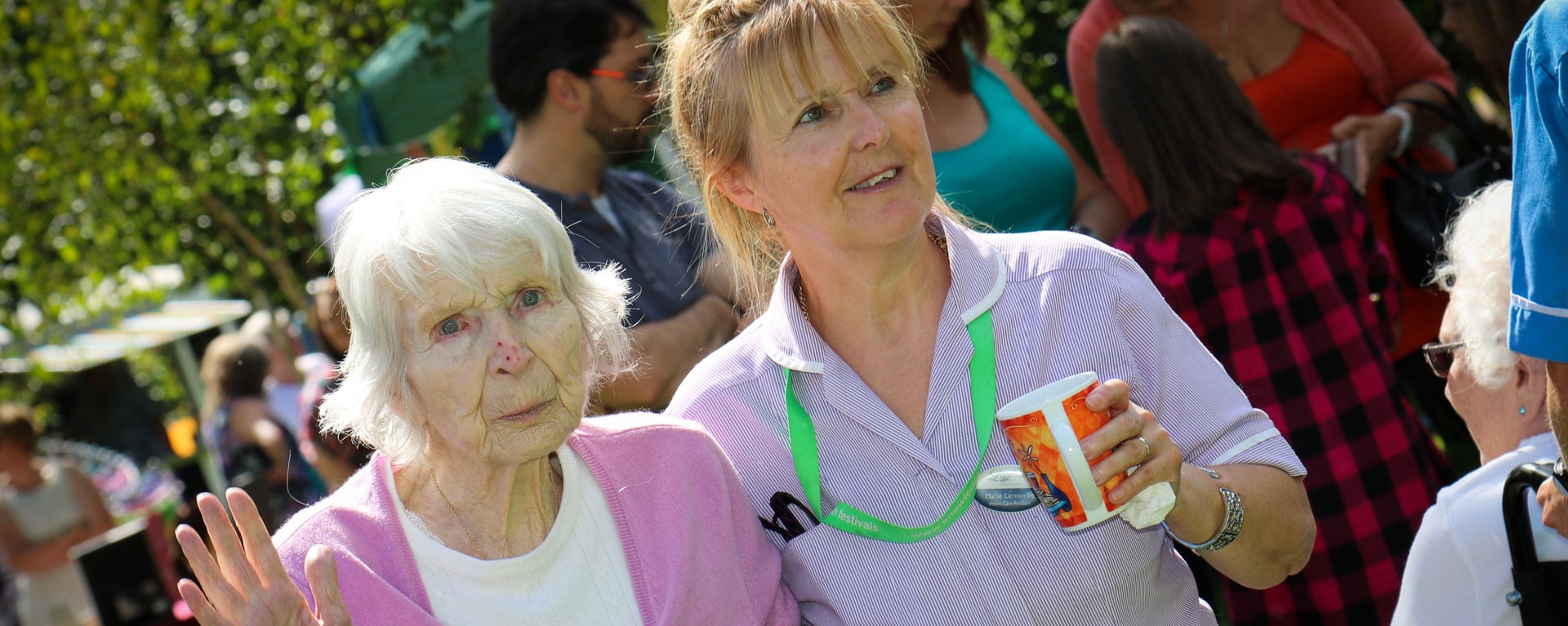 Laurel Care Home nurse with a resident in the garden