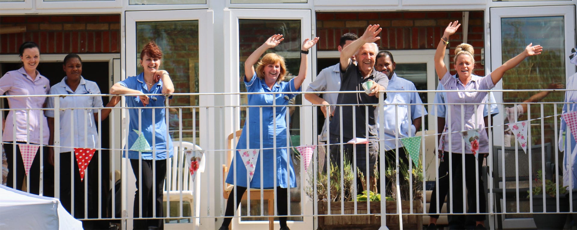 Laurel Care Home staff cheering on the balcony